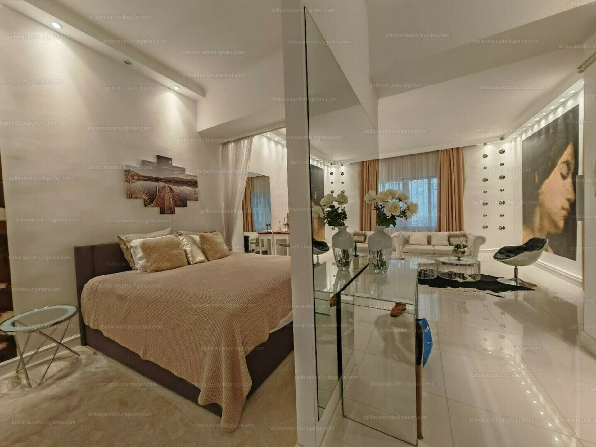 Bedroom with mirror and living reflection