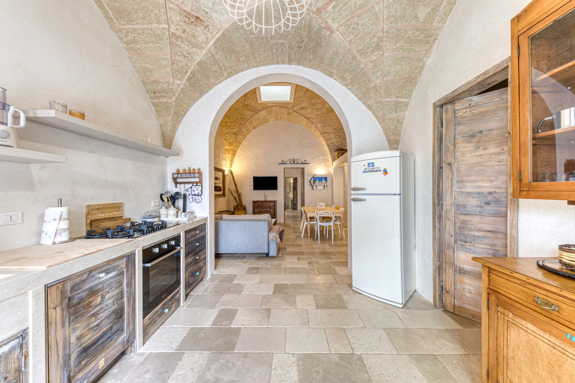 Kitchen with vaulted ceiling and living area