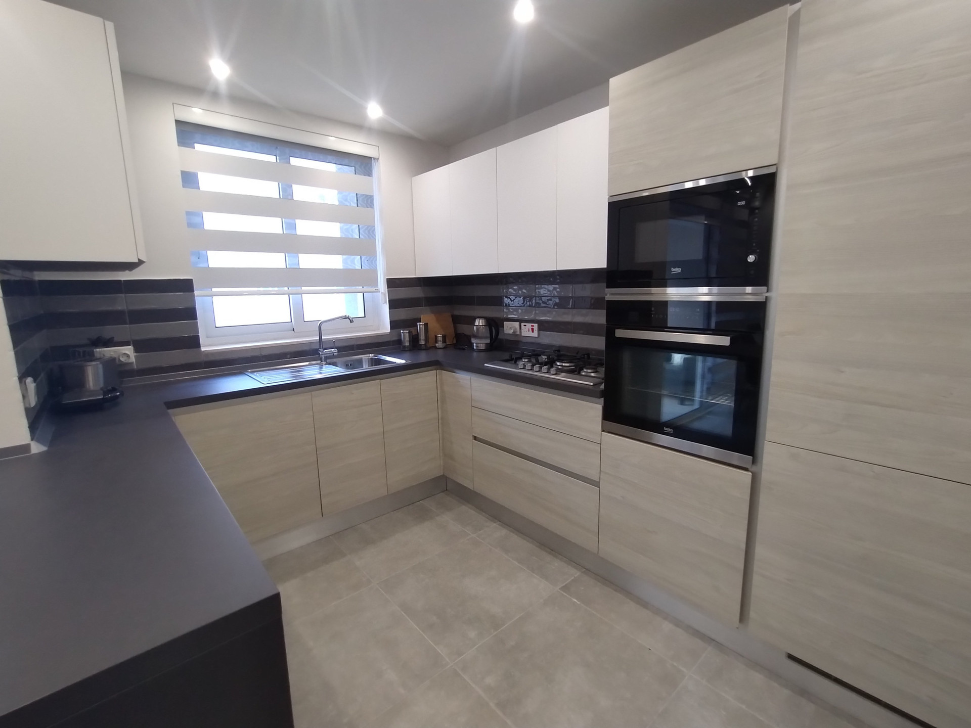 Modern kitchen appliances dark countertop