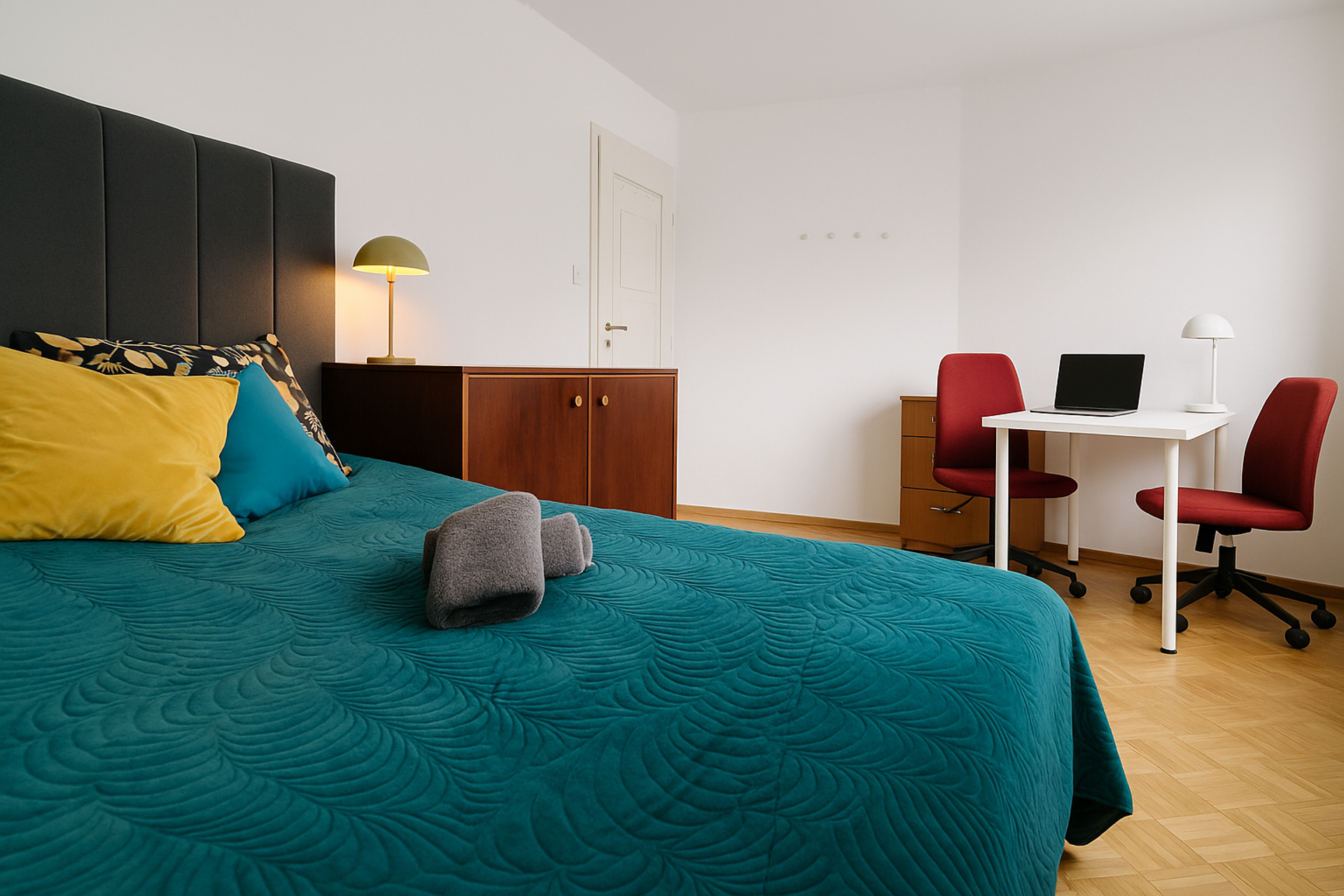 Bedroom with double bed and desk