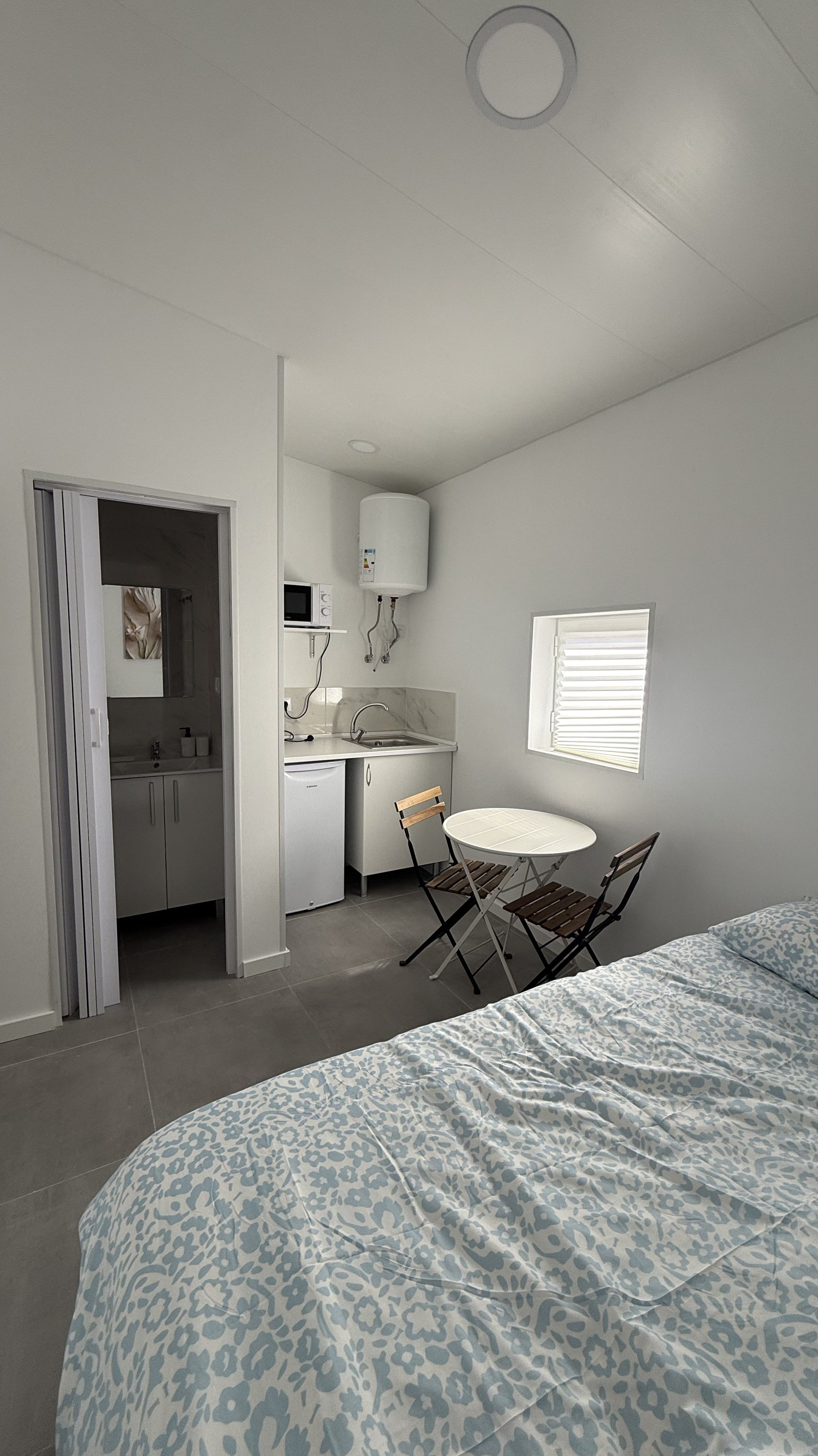 Bedroom with kitchenette and seating