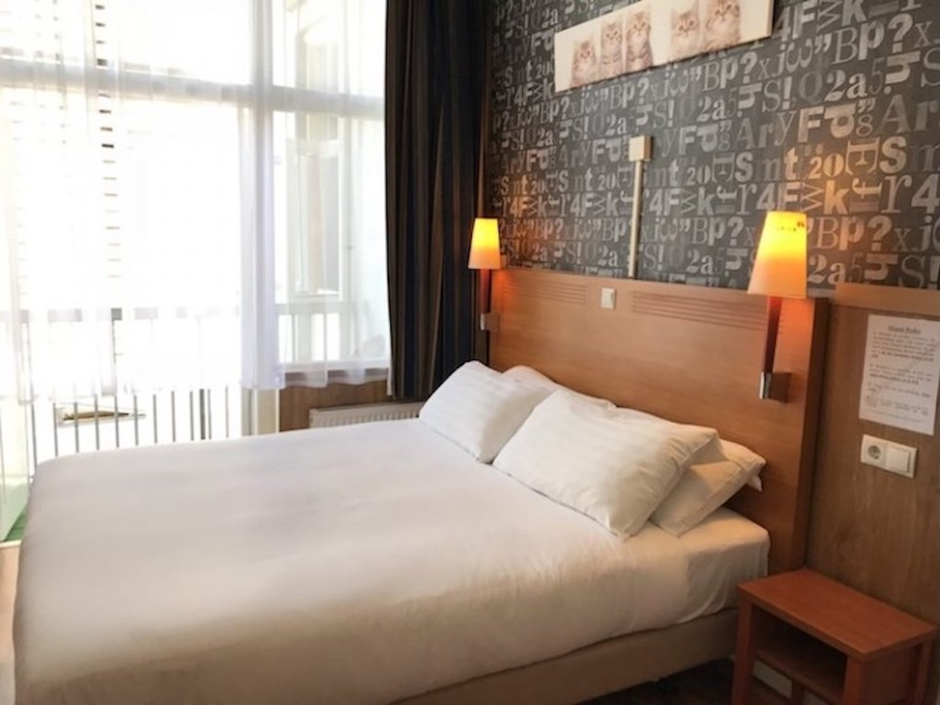 Double bed with wooden headboard