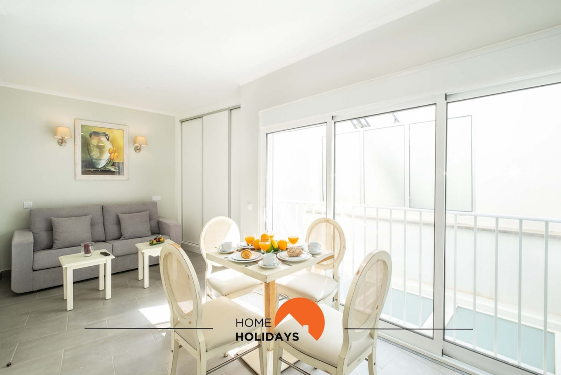 The living room is open, containing a dining area,