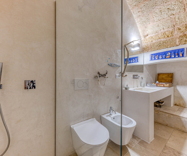 Bathroom with shower and bidet