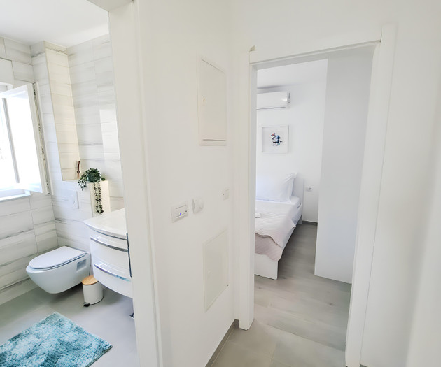 Hallway leading to bathroom and bedroom