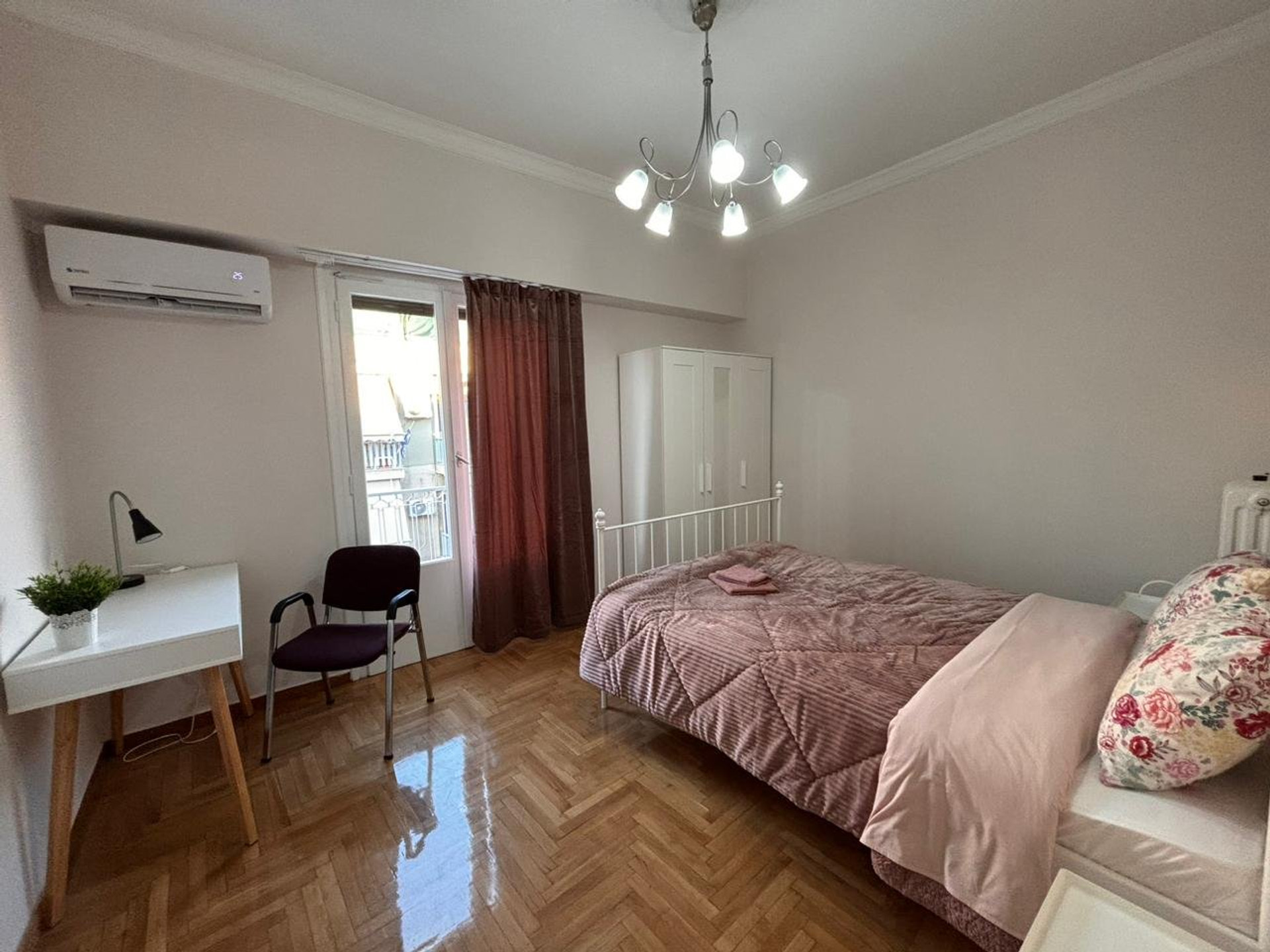 Bedroom with double bed and desk