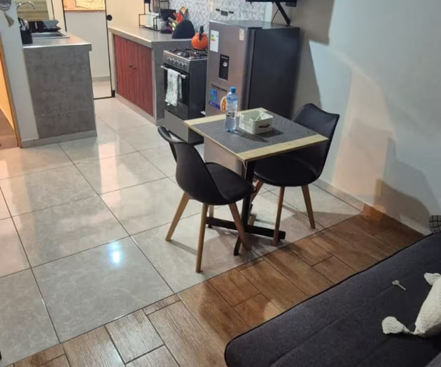 Living room with dining and kitchen
