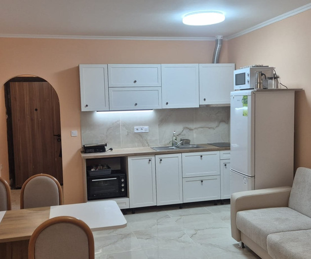 Light studio with balcony close to sea and center
