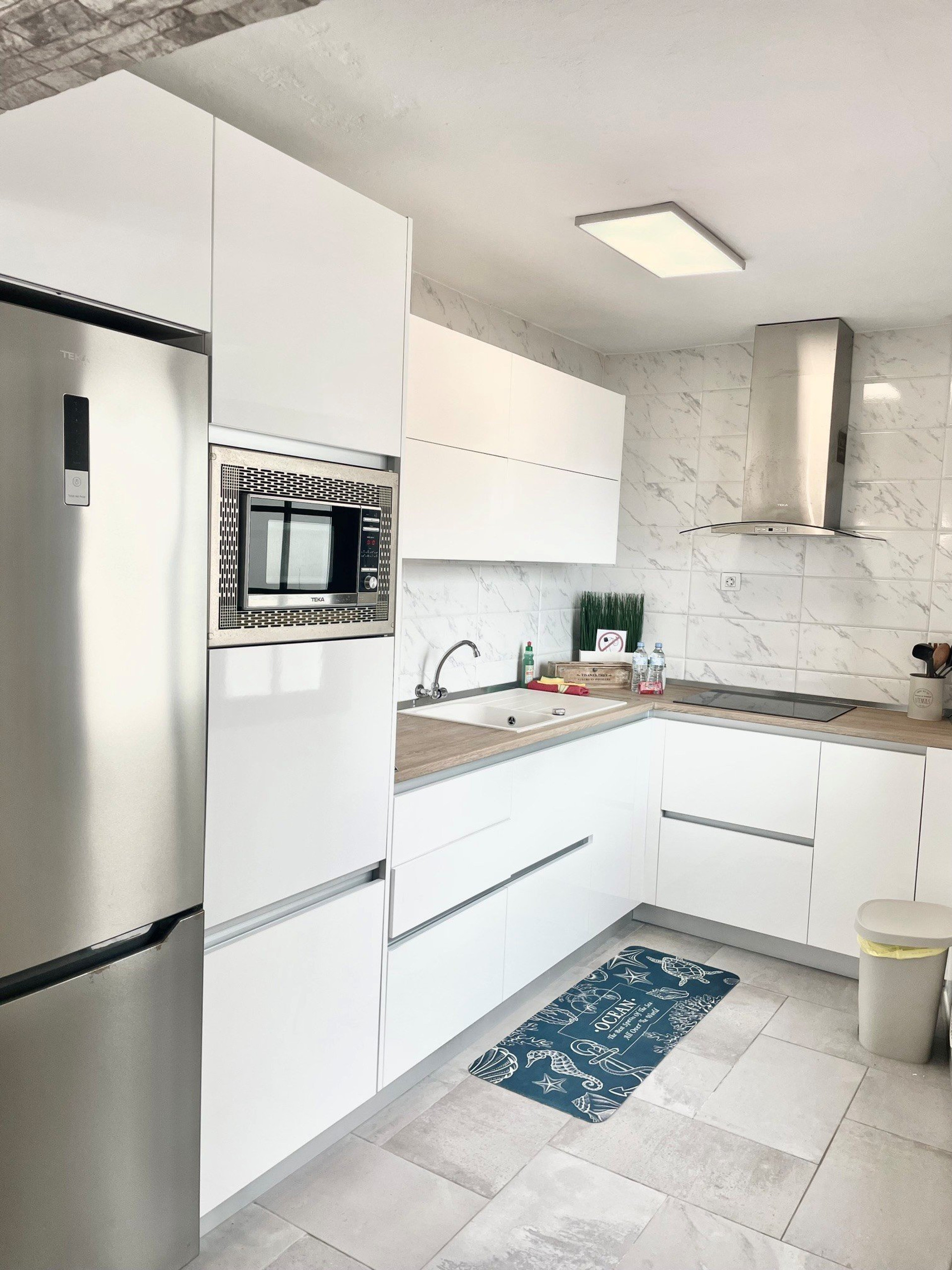 Modern white kitchen fully equipped