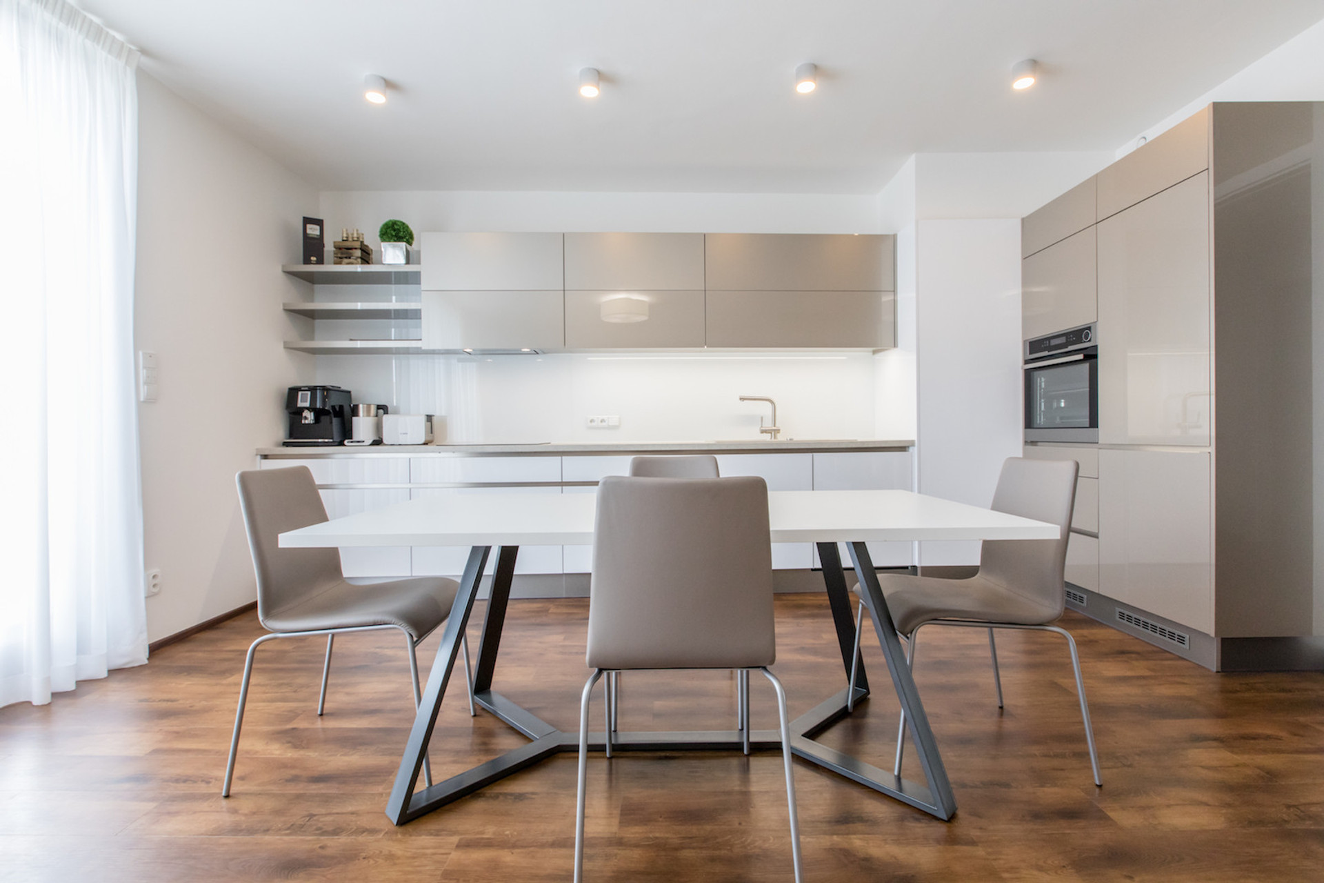 Kitchen & Living room with direct access to the terrace oriented to the South. All windows within the apartment have installed electric blinds.
