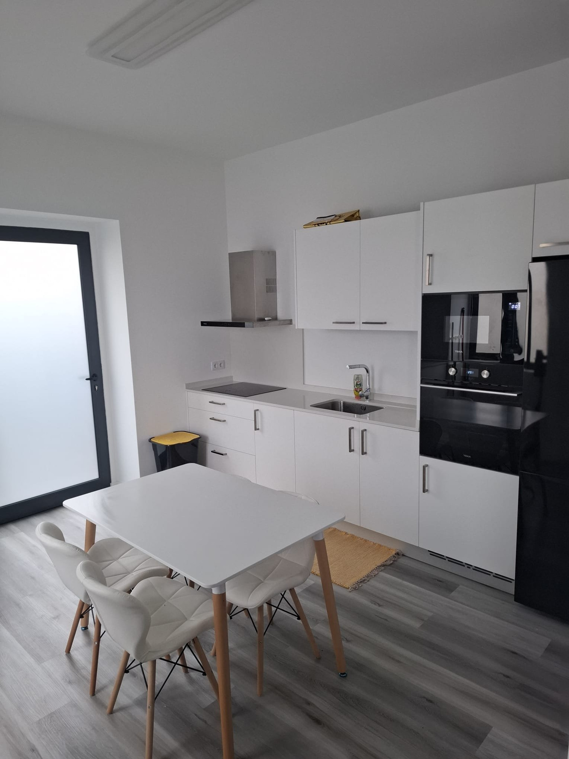Modern white kitchen and dining