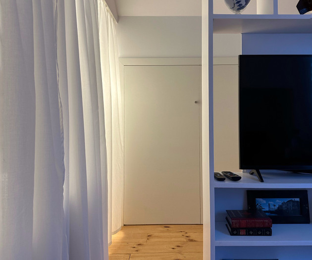 Hallway with TV storage unit