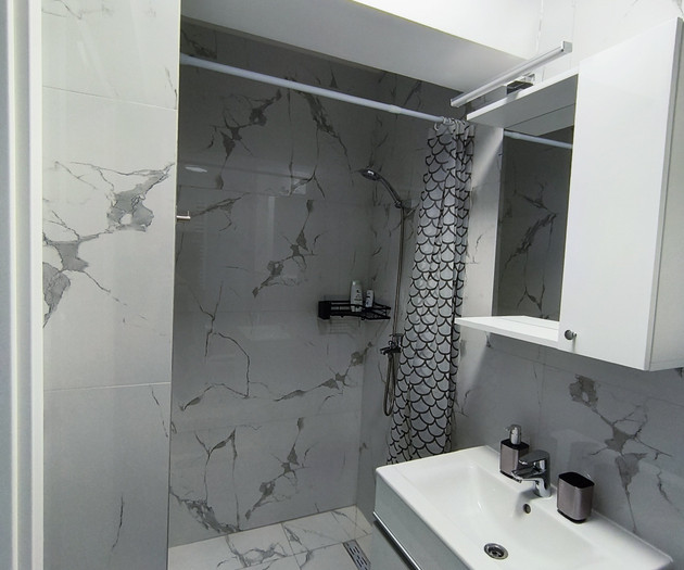 Modern marble bathroom with shower