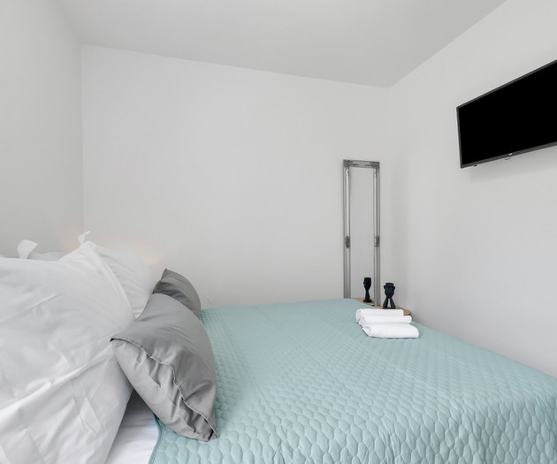 Bedroom with teal bedspread