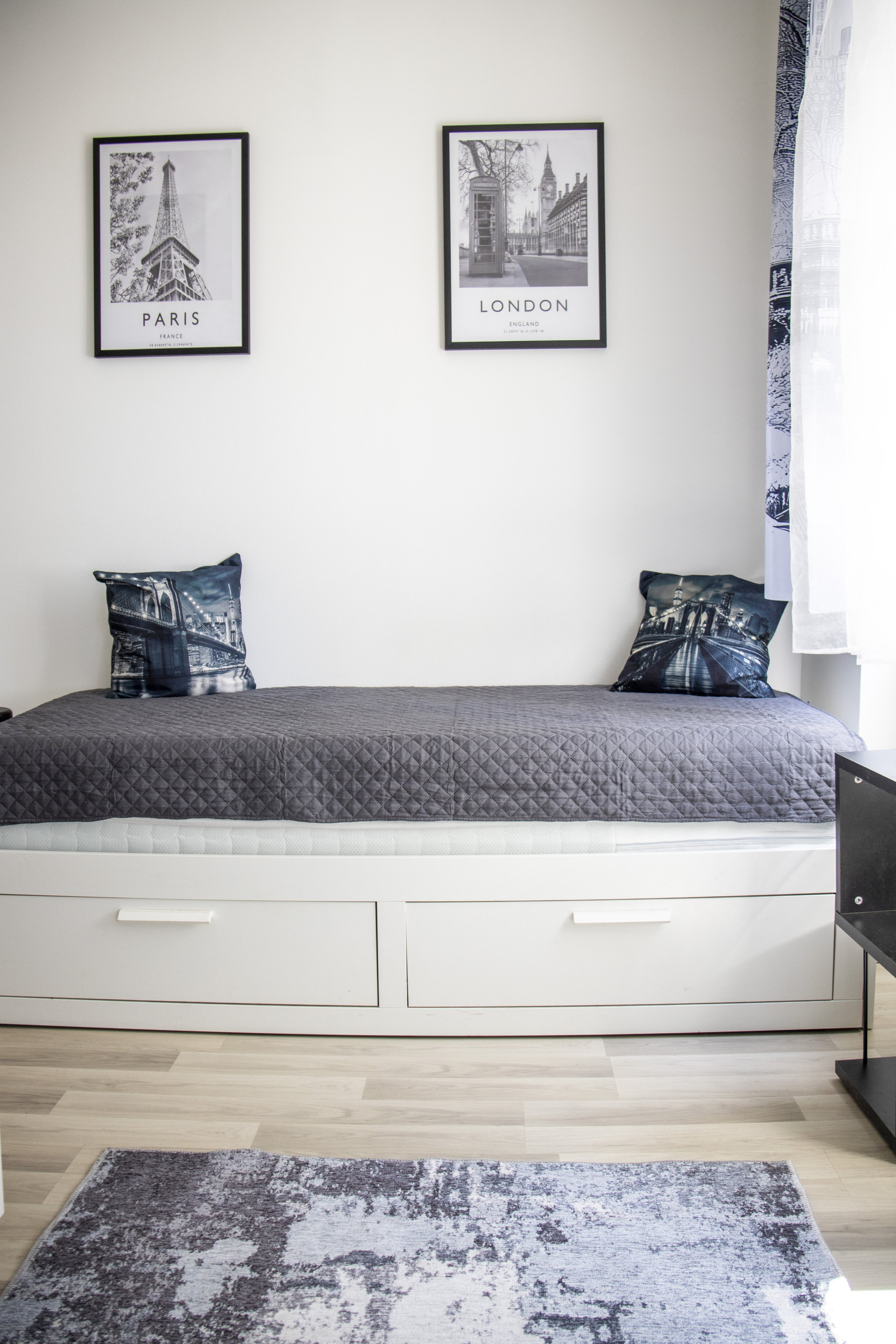 Daybed with travel-themed art
