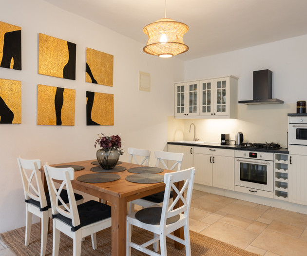 Kitchen with gold wall art