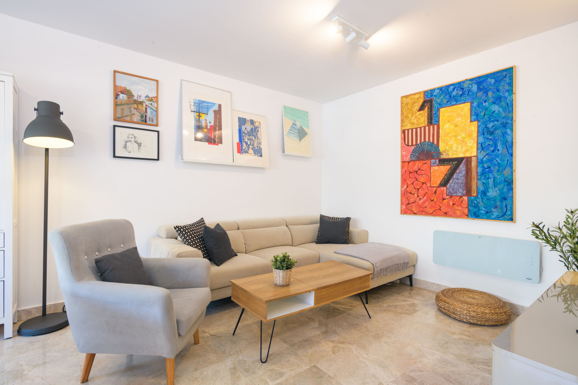 Living room with colorful artwork