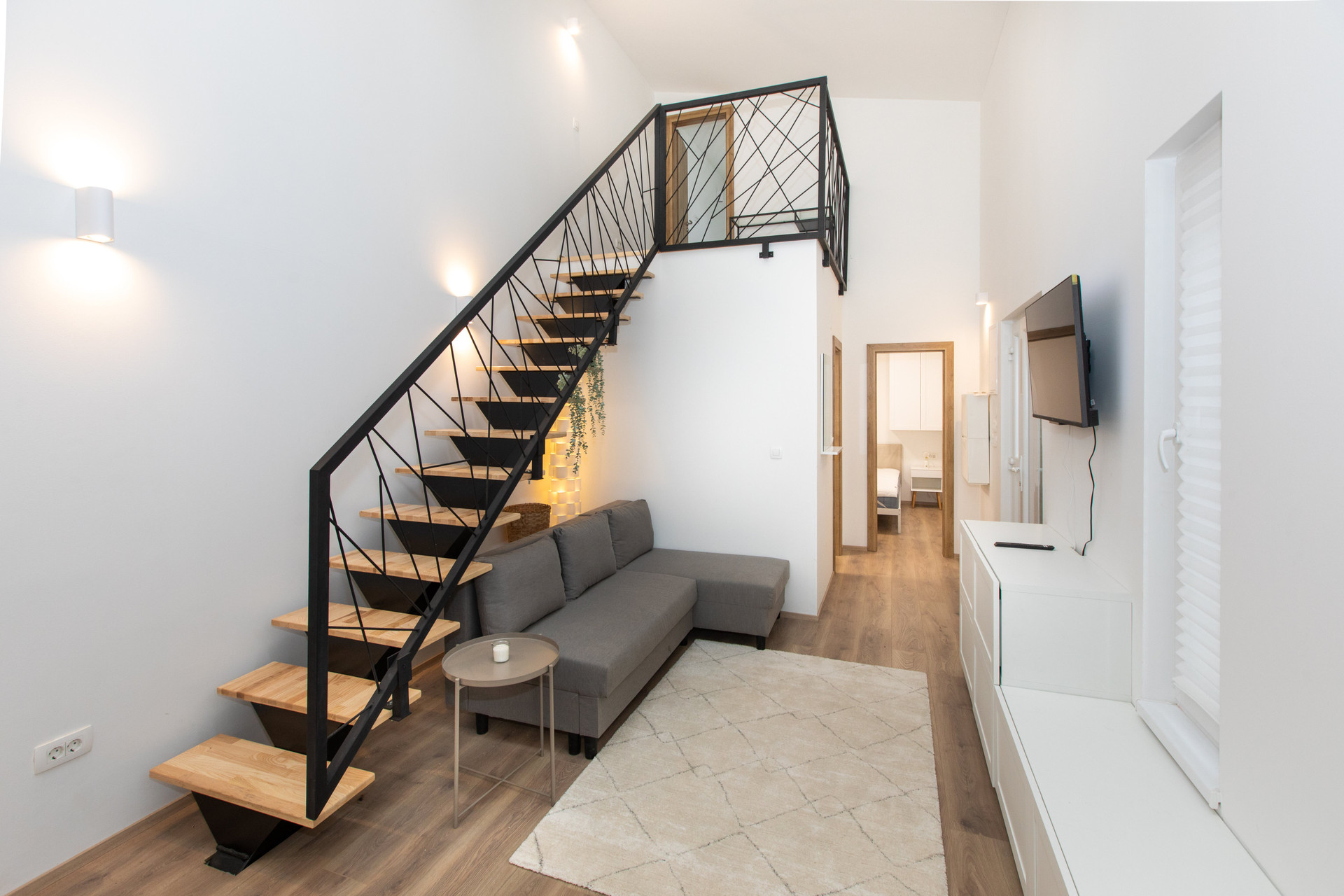 Living room staircase warm lighting