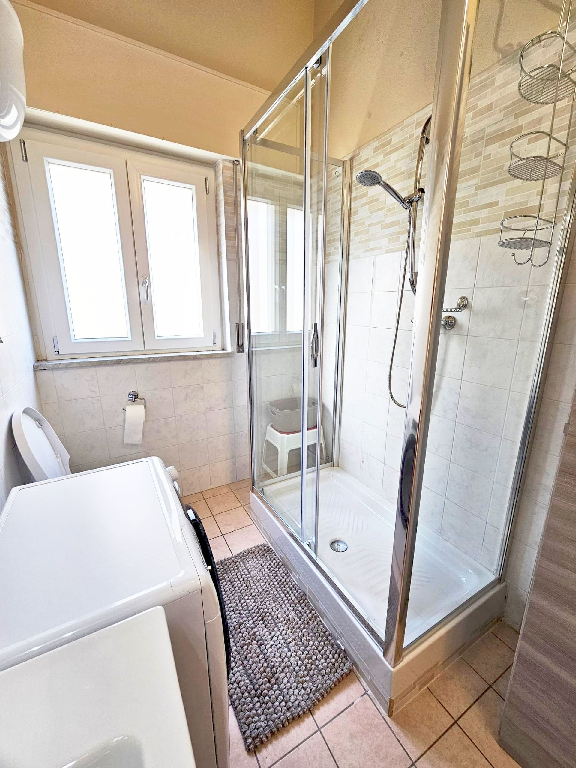 Bathroom with shower and laundry