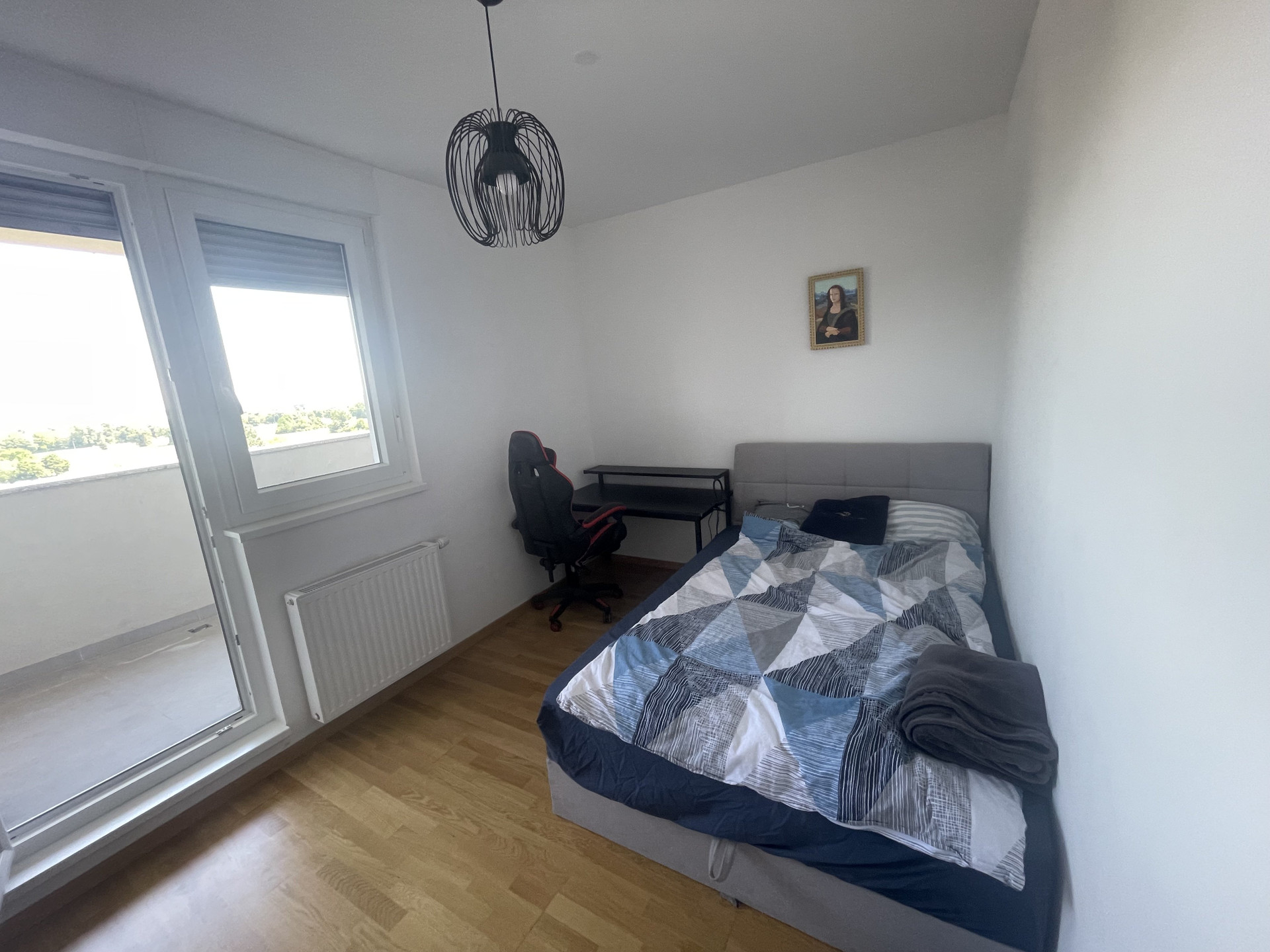 Bedroom with desk and window