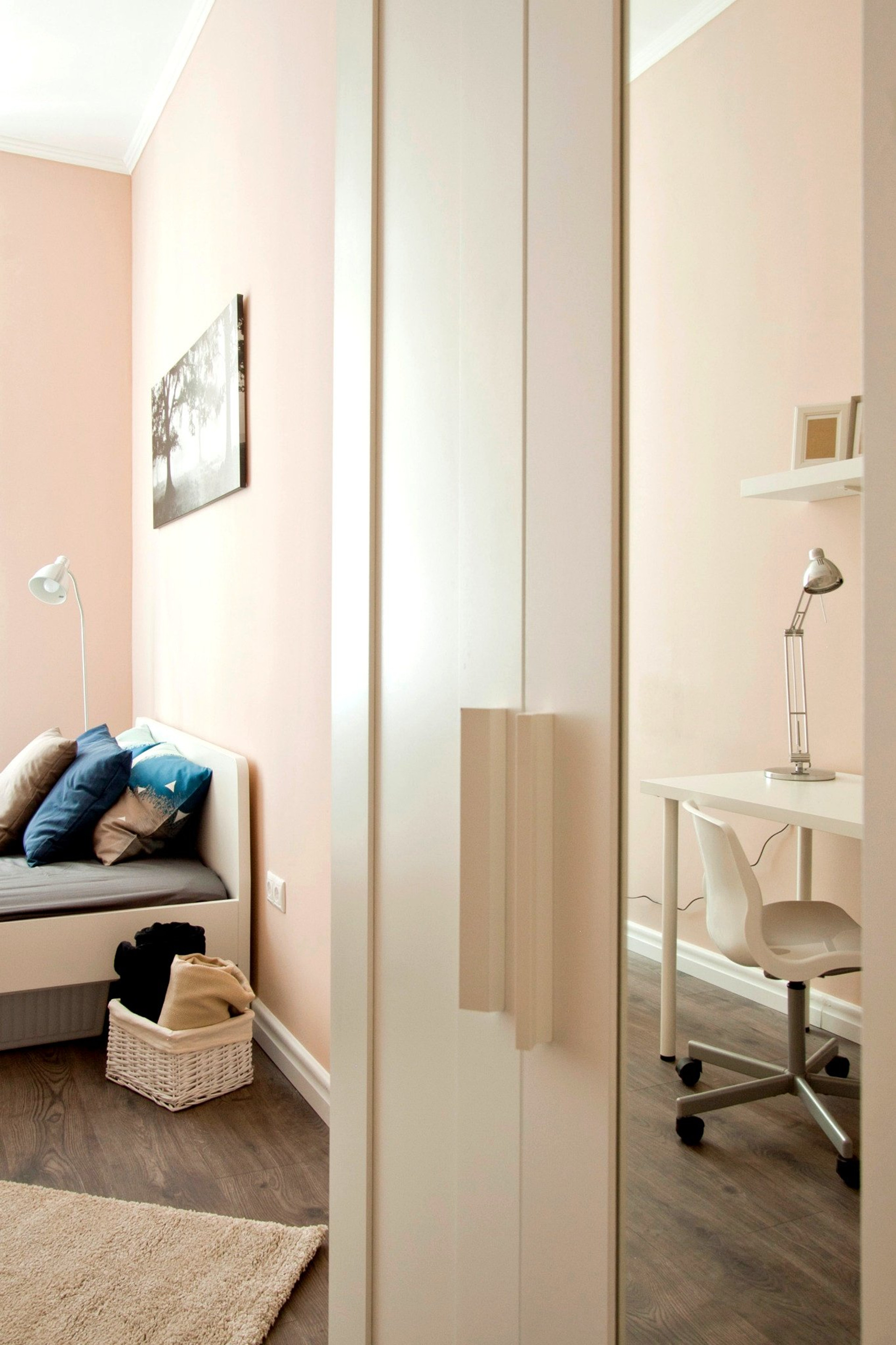 Large wardrobe providing generous storage space for clothes and personal belongings.