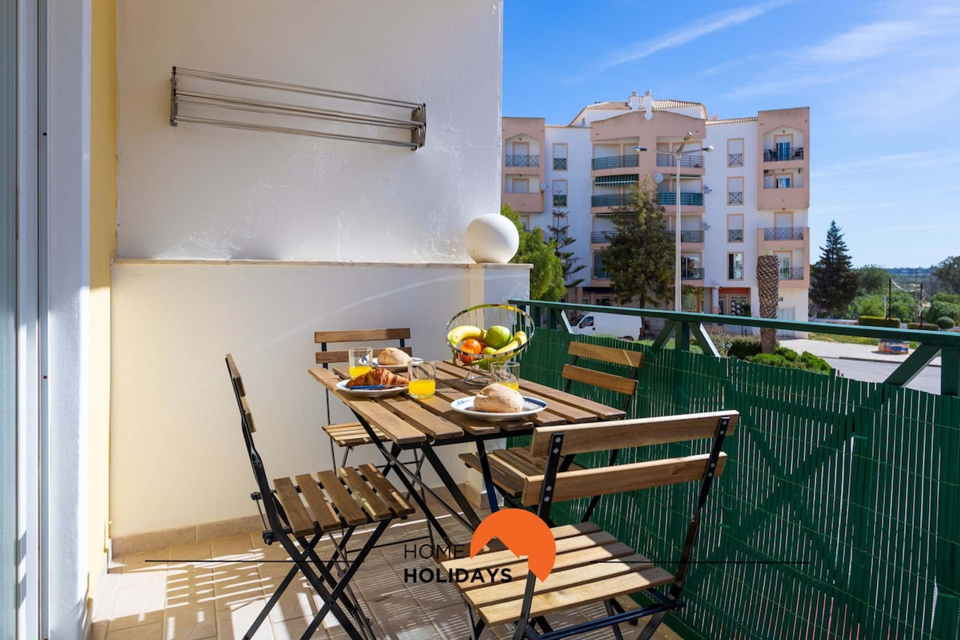 Balcony equipped with table and clothesline