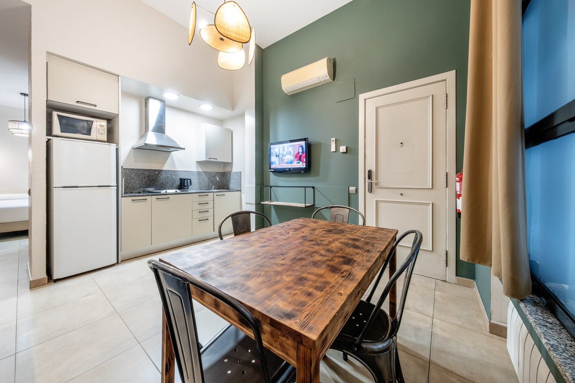 Dining area with kitchen behind