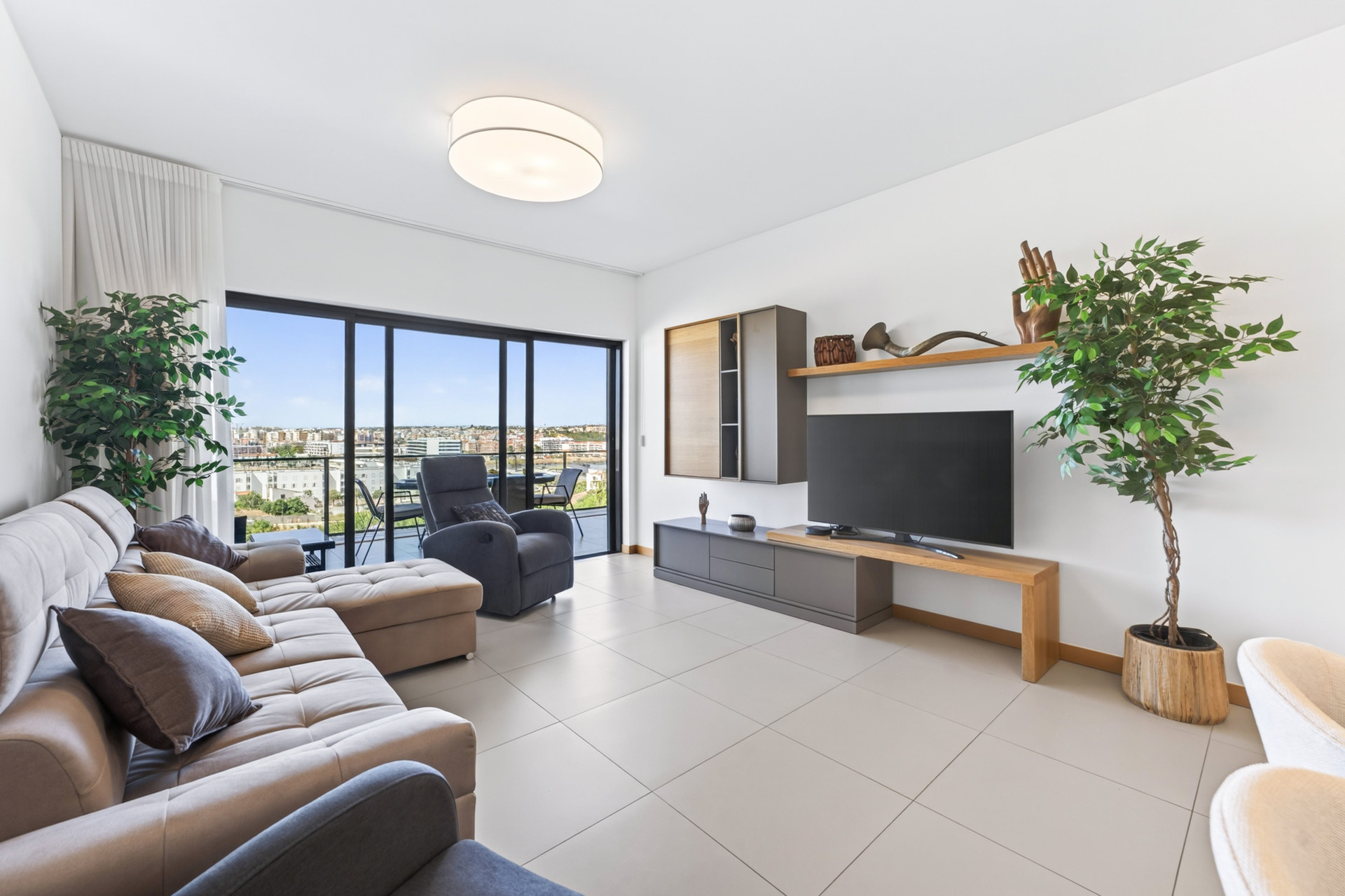 Living room with TV and balcony