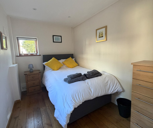 Bedroom with yellow pillows