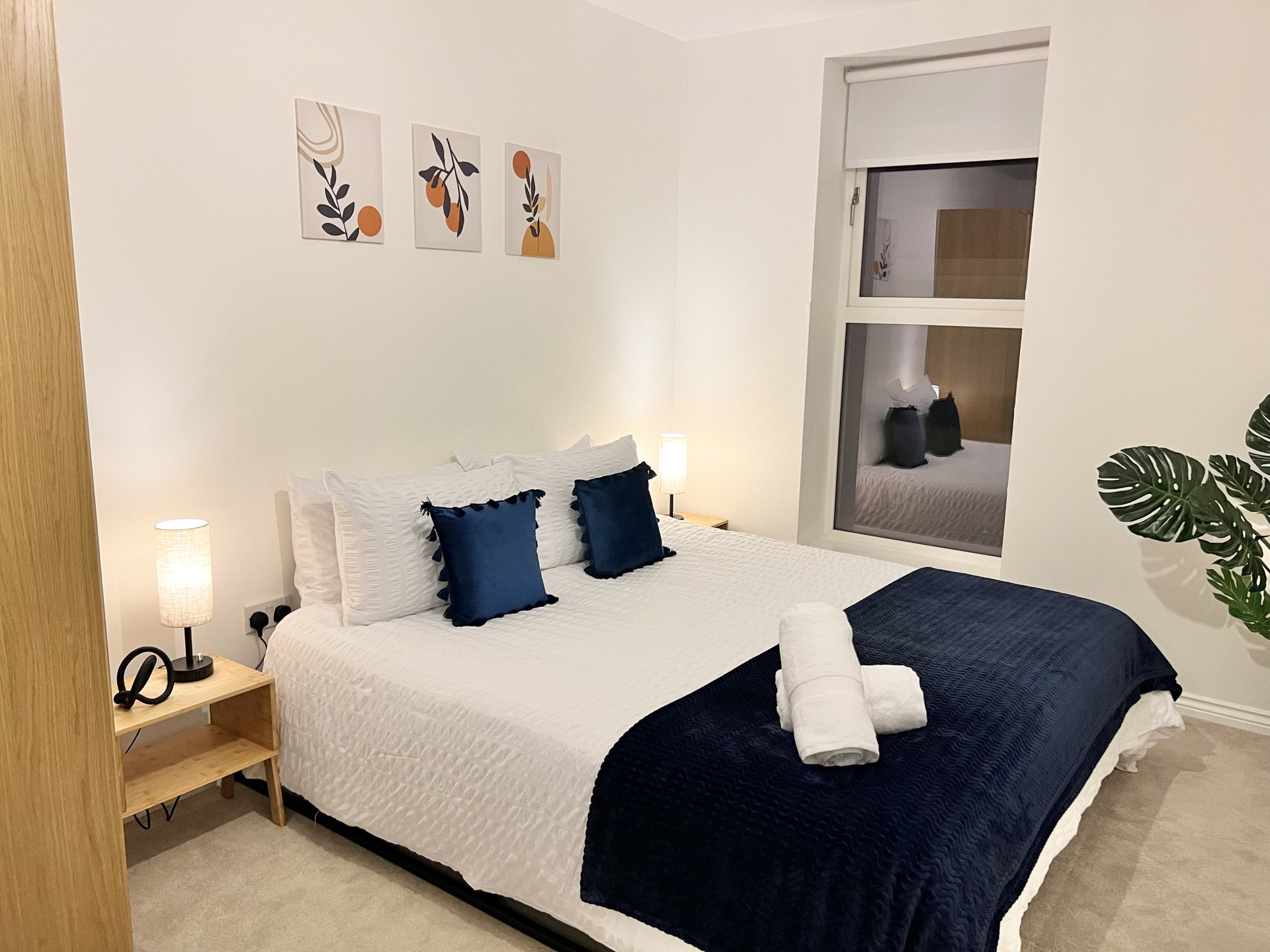 Bedroom 1: Comfortable super king bed with side tables. Towels provided.