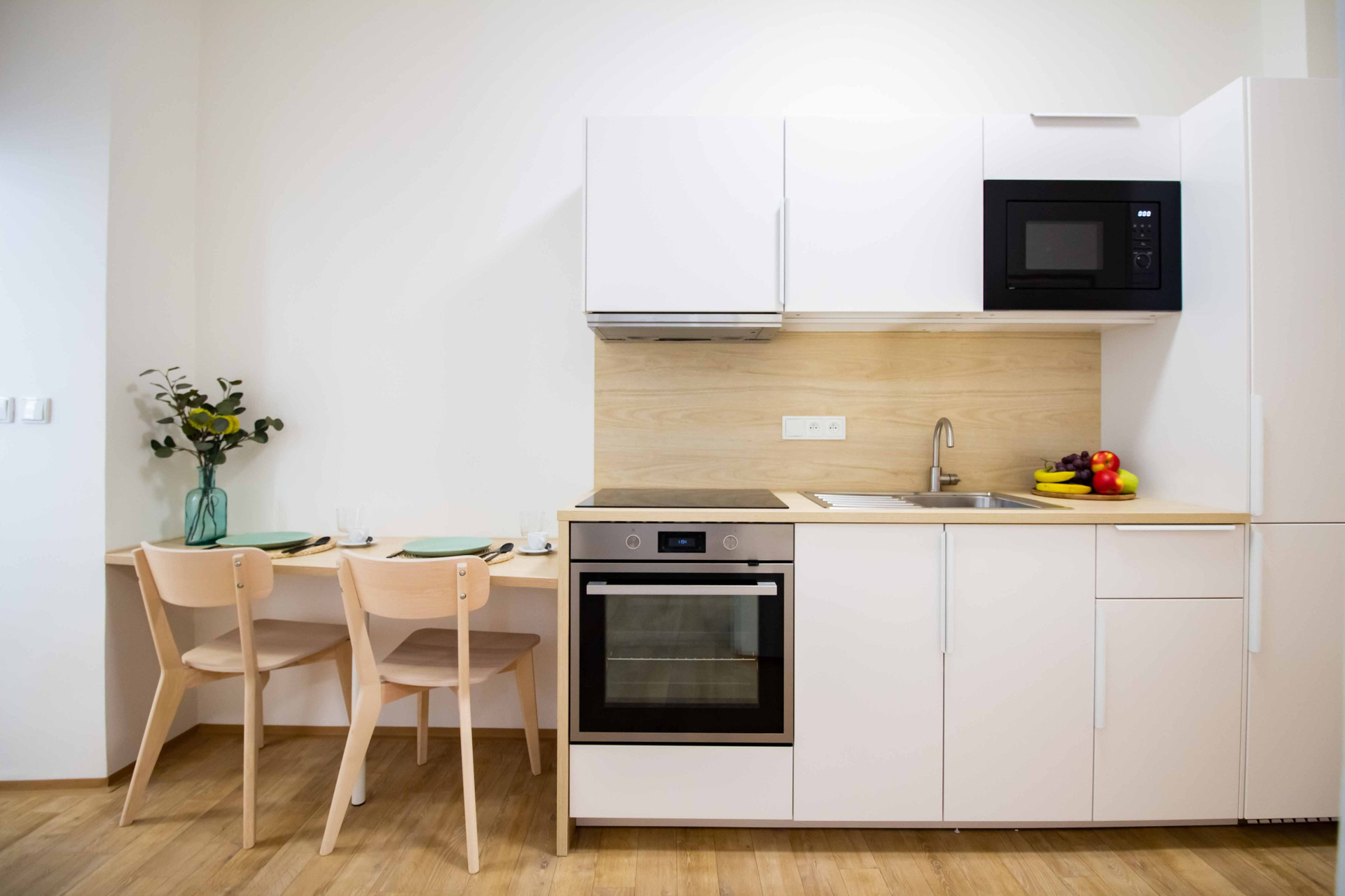 White kitchen with dining table