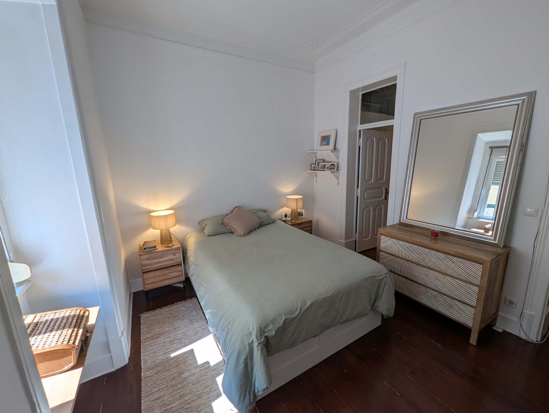 Bright bedroom with dresser and mirror