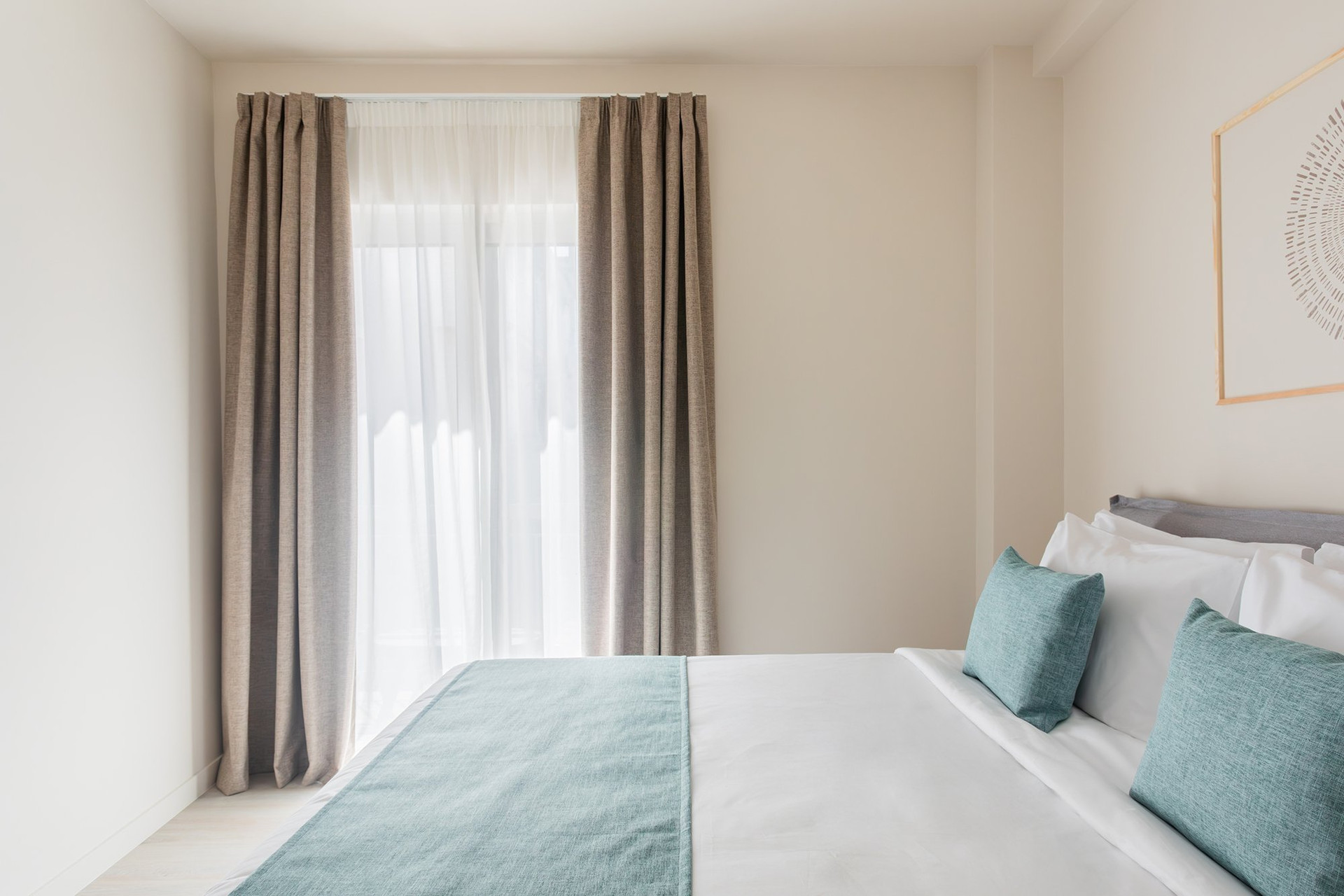 Bedroom with large draped window