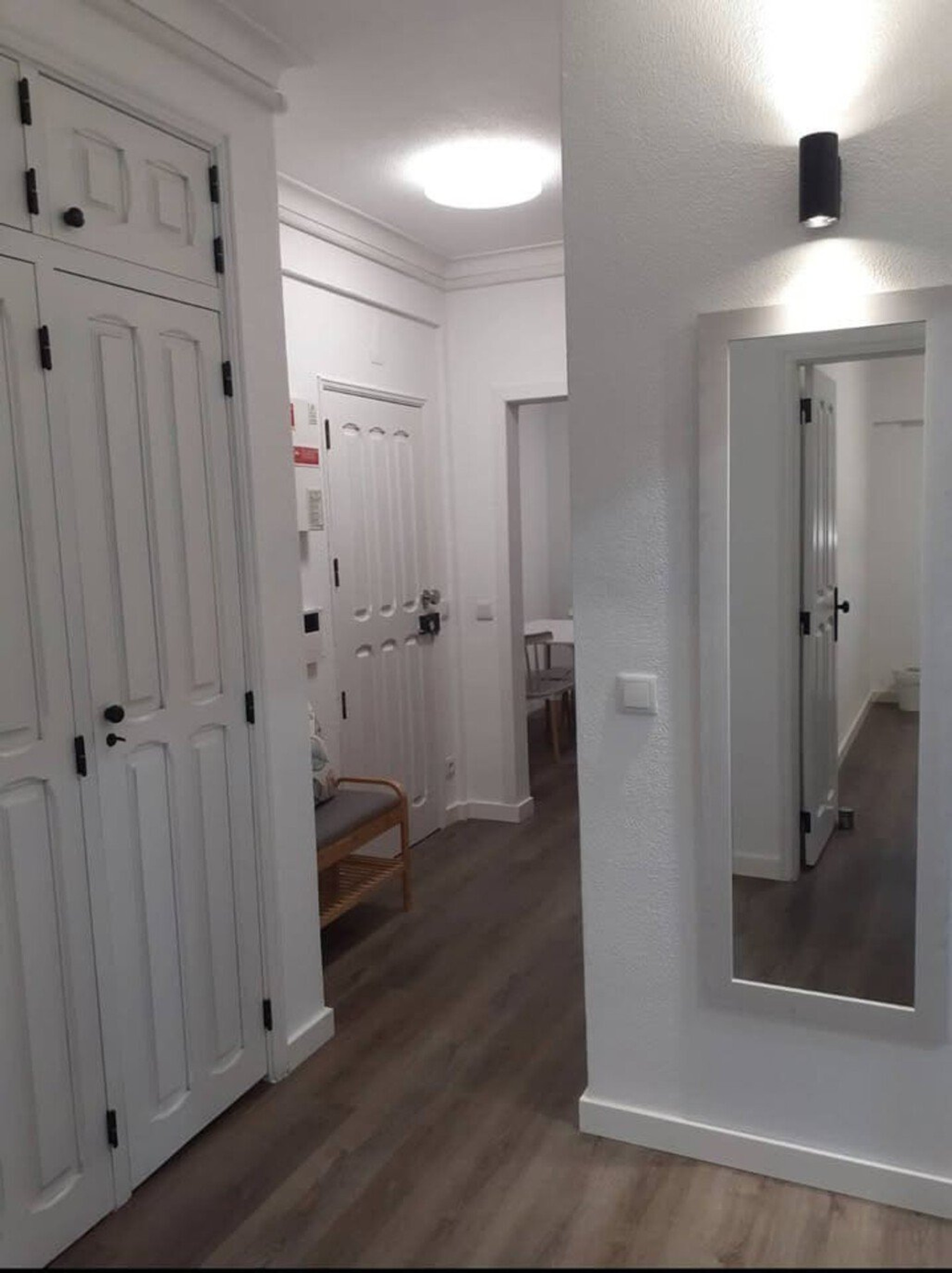 Hallway with mirror and closet