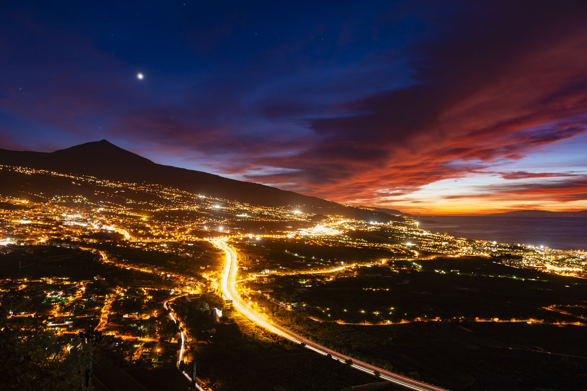 Nighttime mountain and coastal view