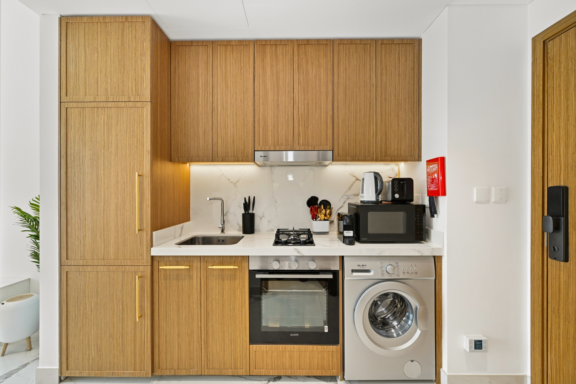 Compact kitchen with appliances and storage