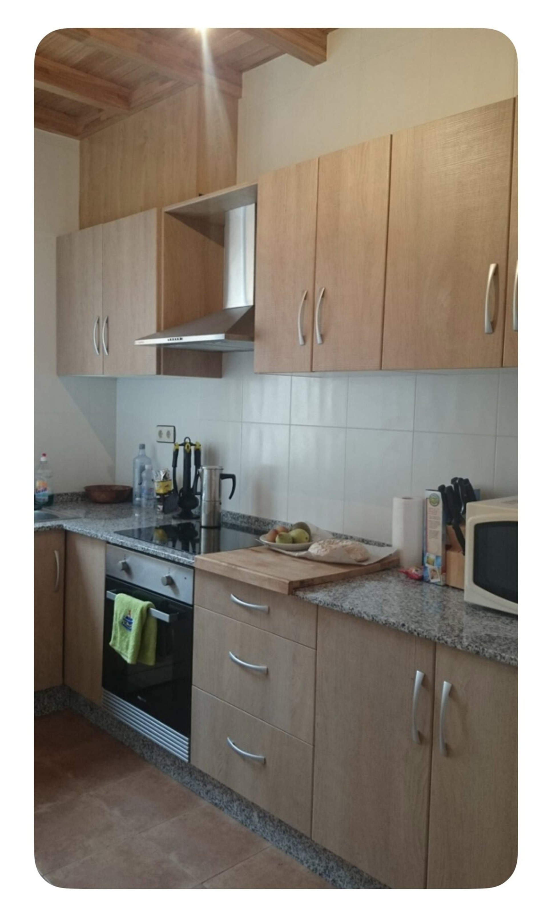 Kitchen with stove and cabinets