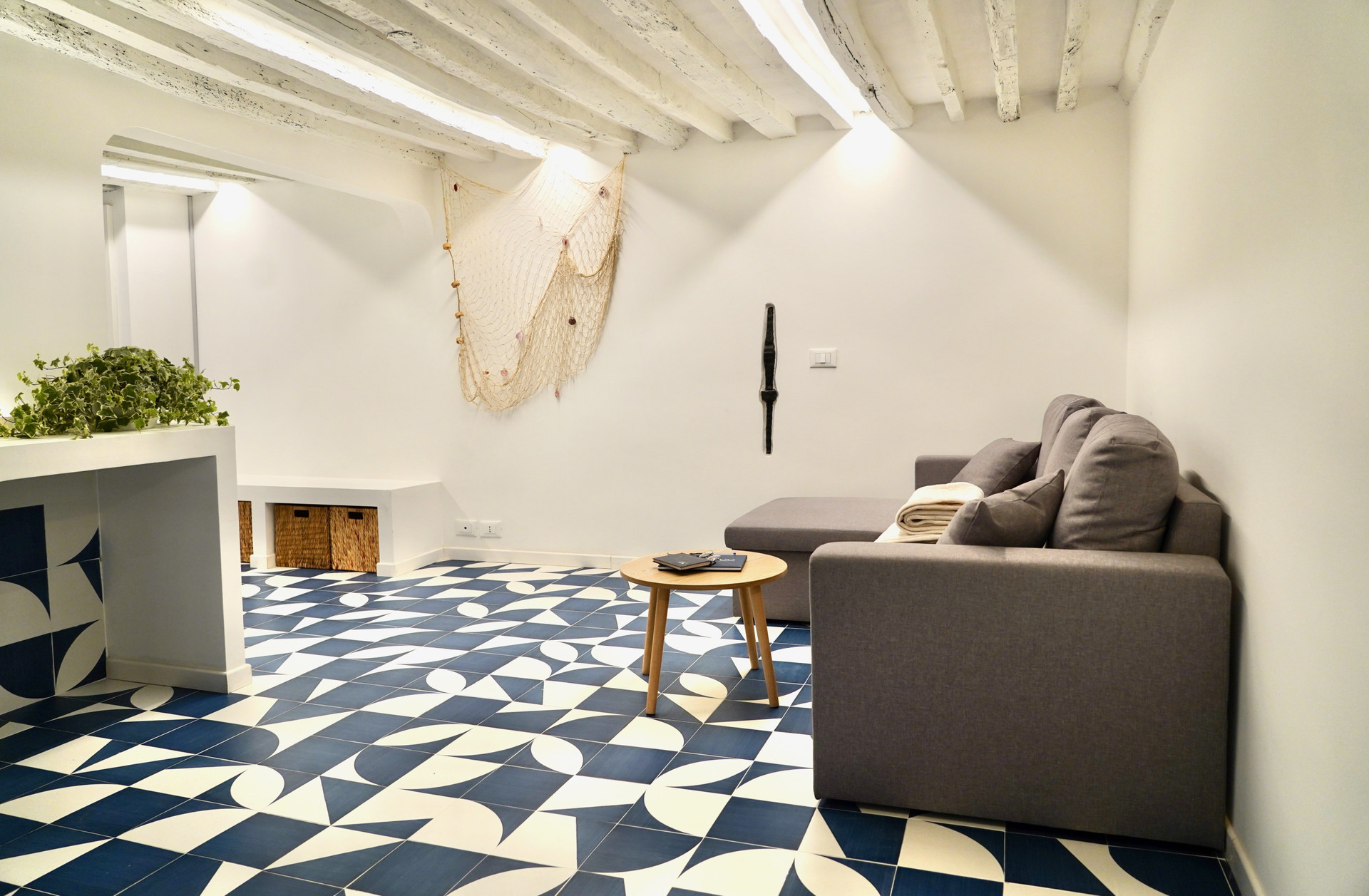 Living room with sofa beamed ceiling