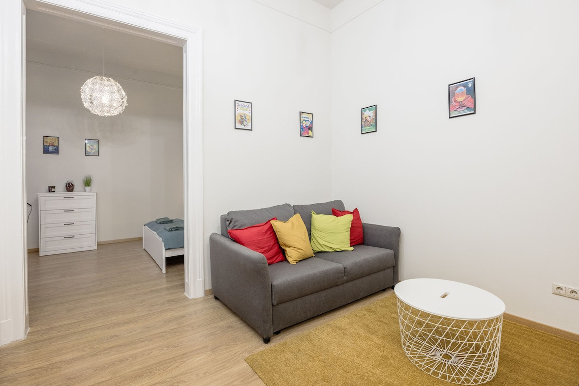 Seating area in living room, entrance to main bedroom (there is a double door opening inwards)