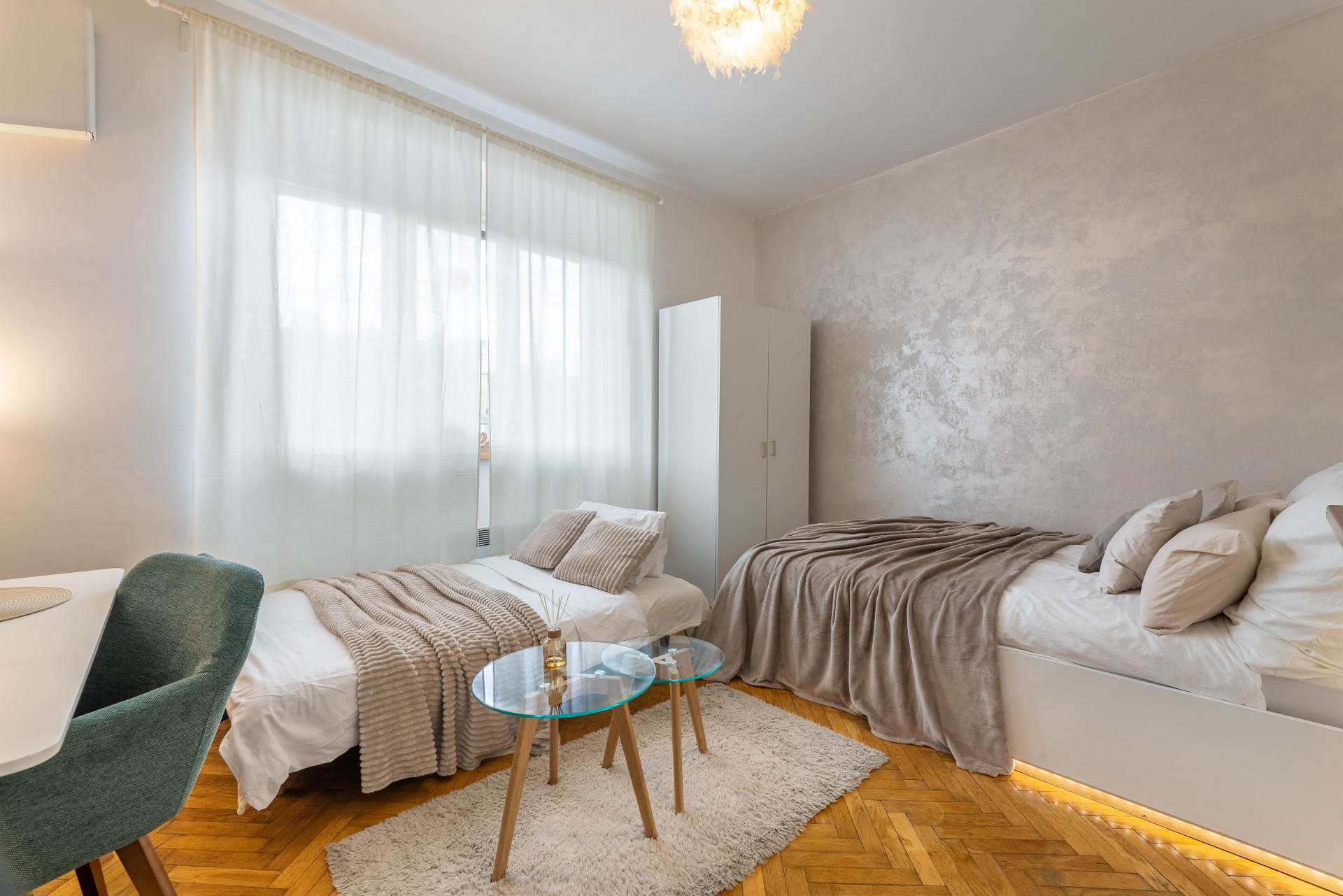 Studio with two beds and windows