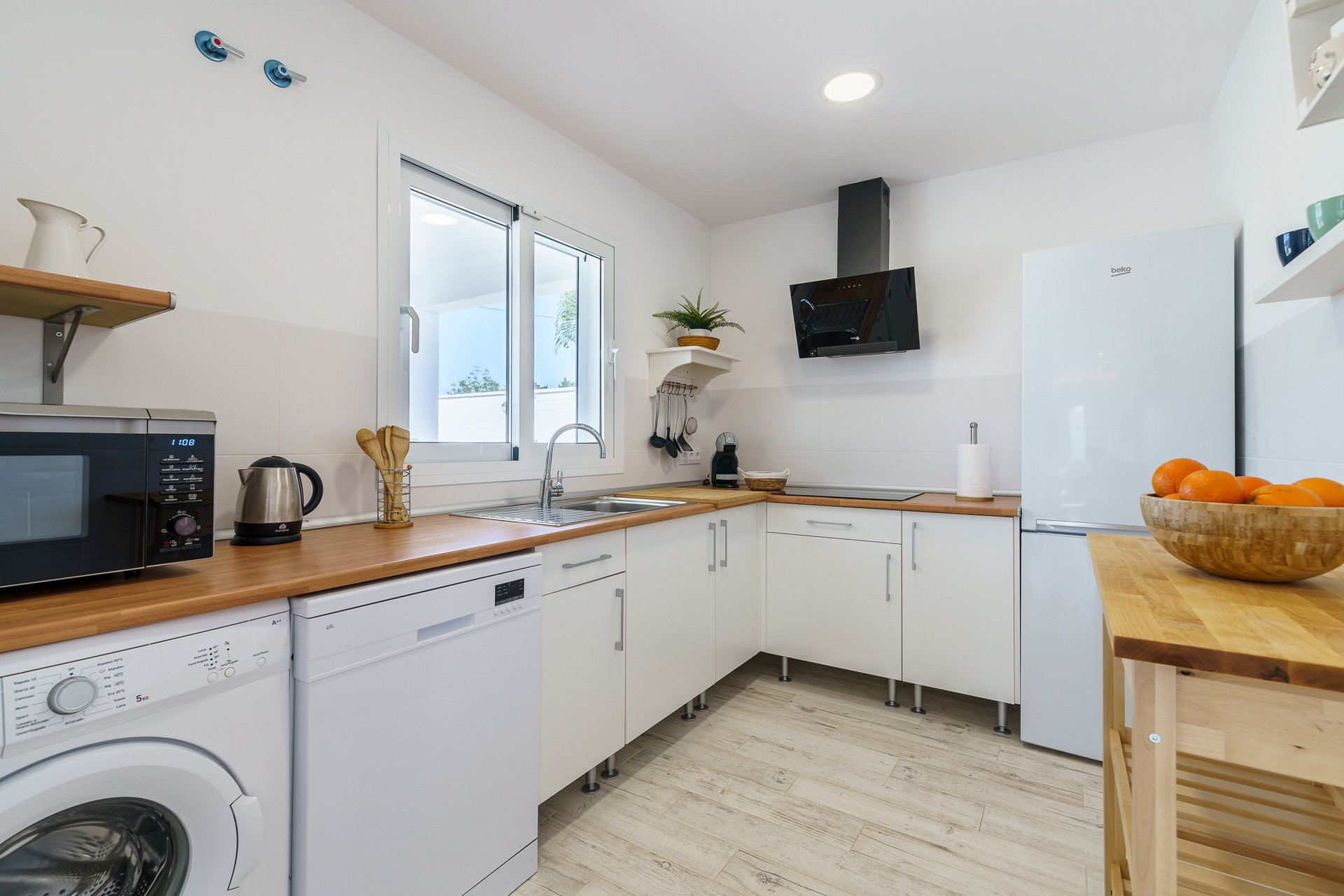 White kitchen with wood countertops