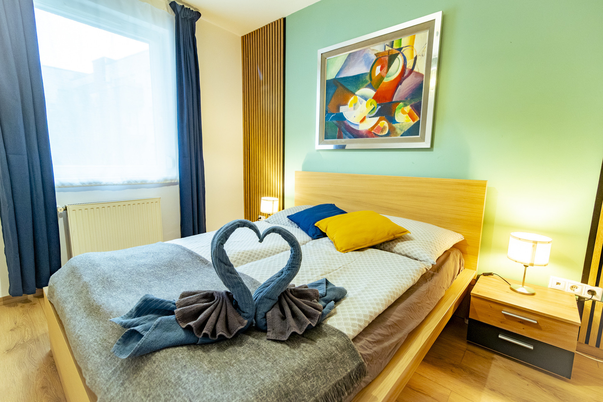 Bedroom double bed colorful artwork