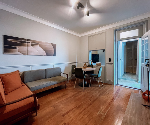 Bright living room with orange sofa