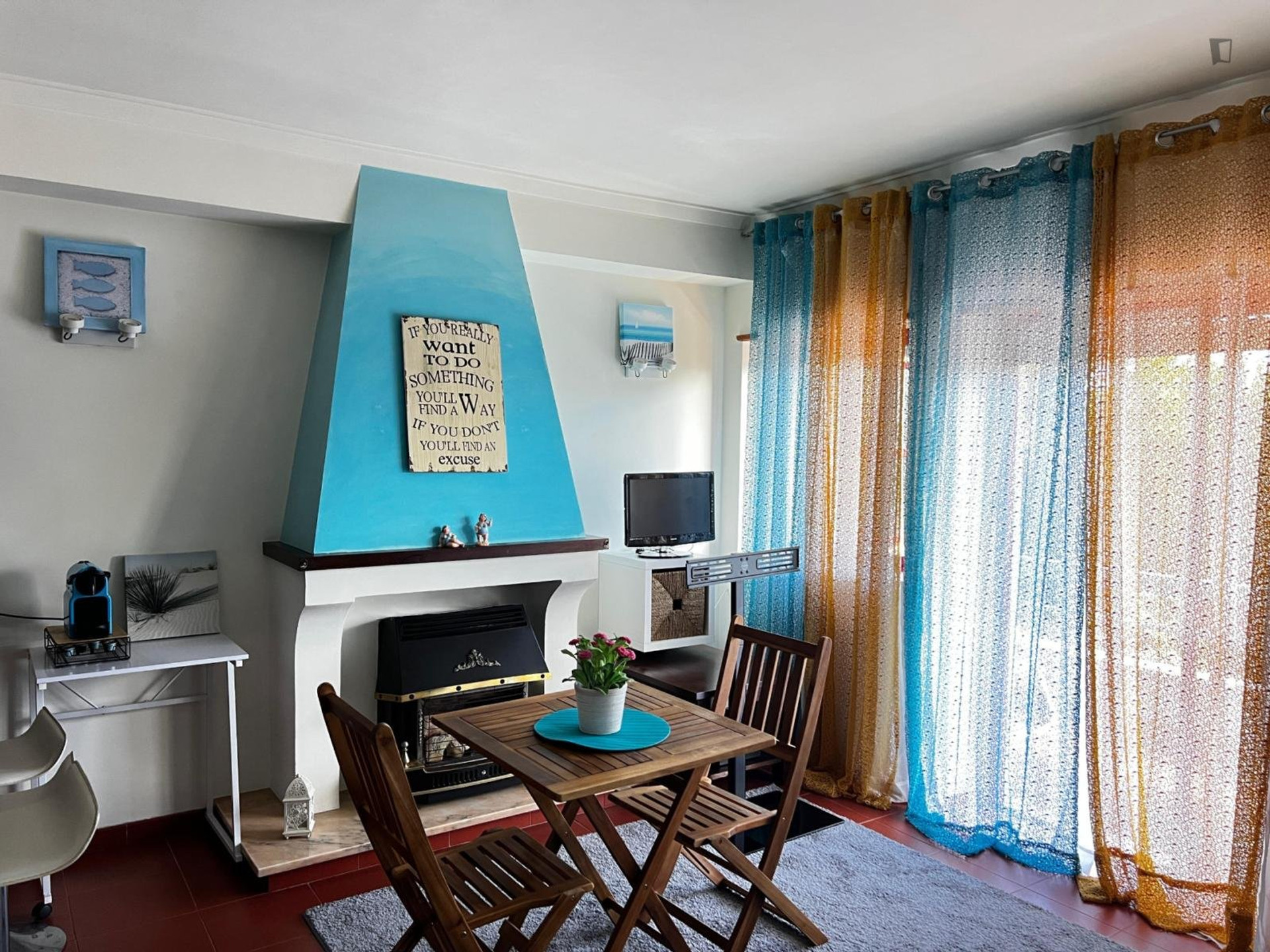 Living room with fireplace, dining table