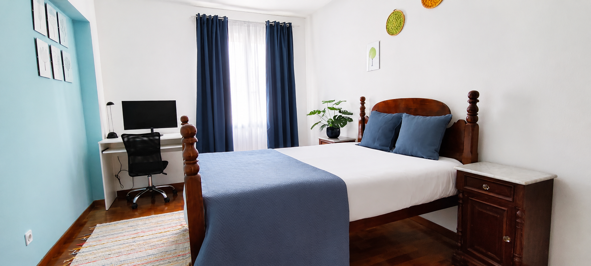 Bedroom with desk and double bed