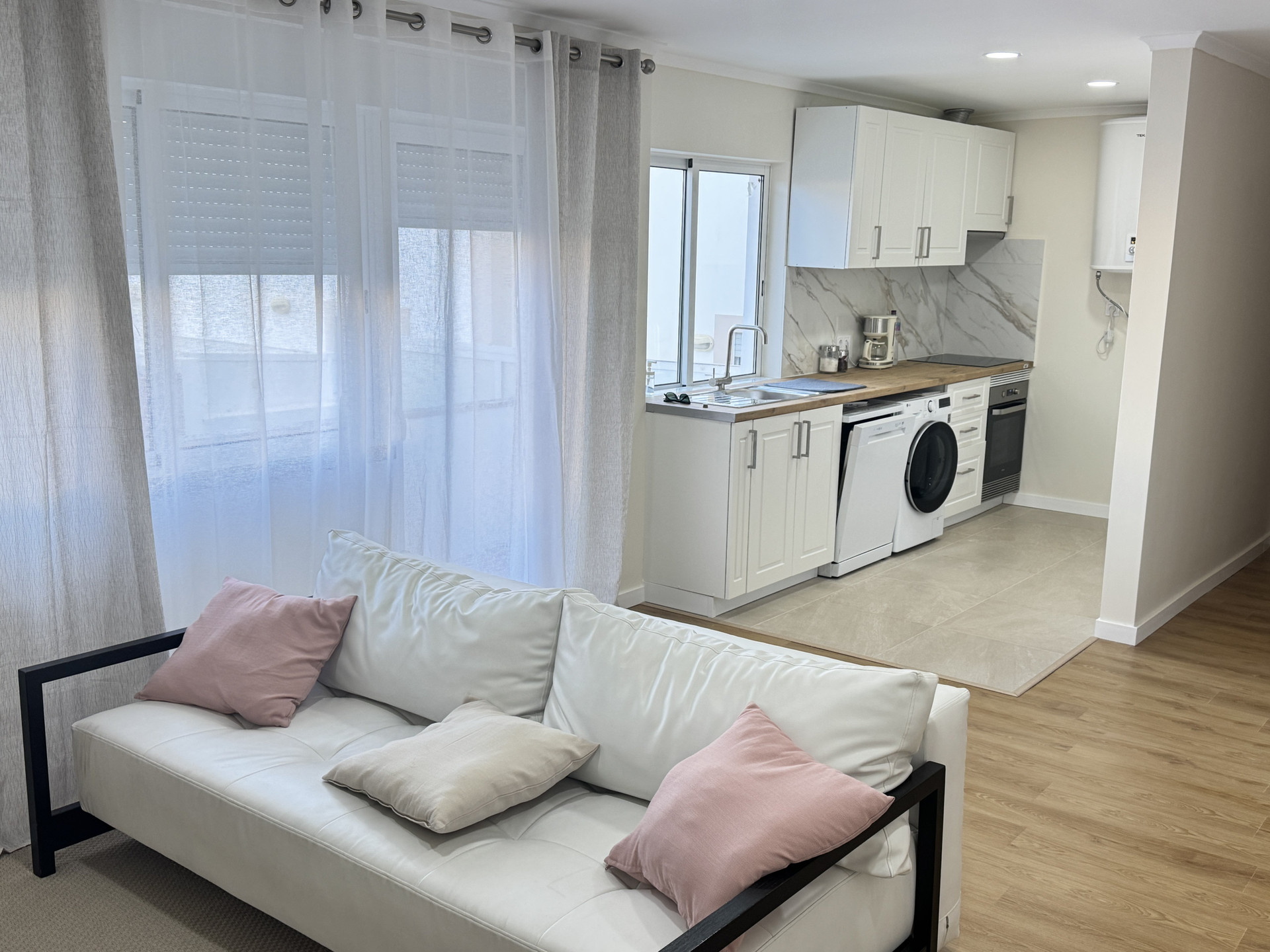 Living room with open kitchen view