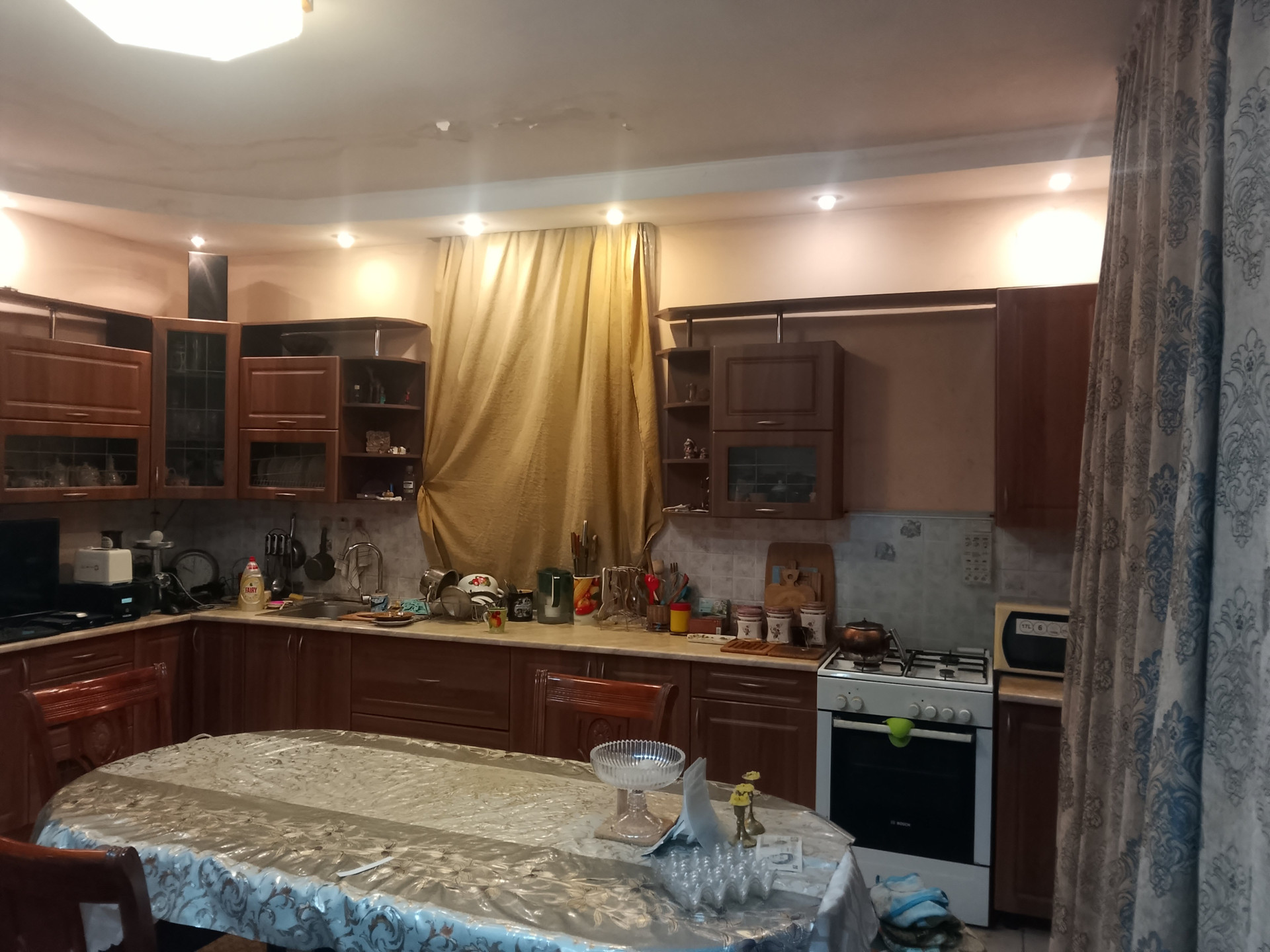 Full kitchen with cabinets and stove