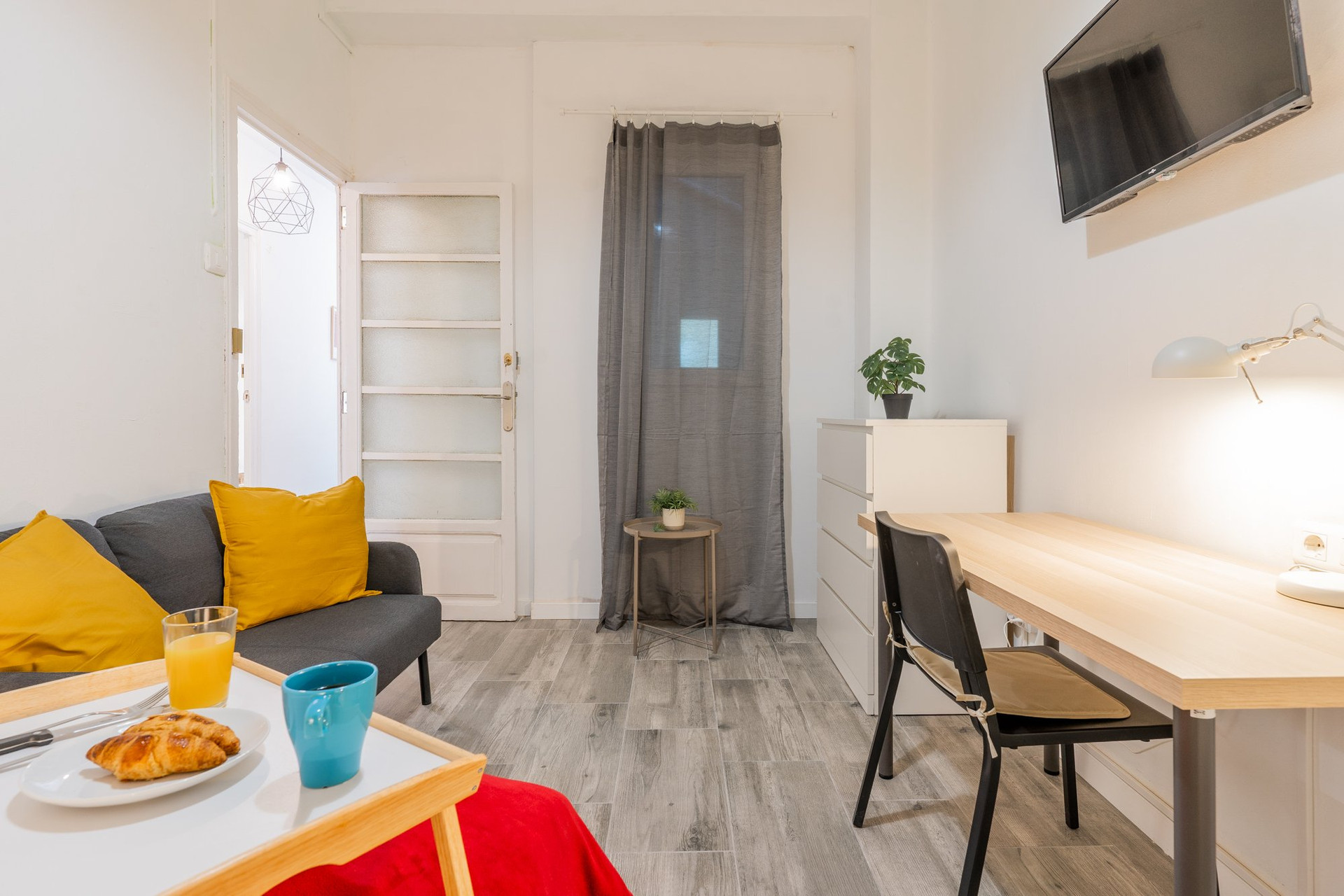 Studio living area with TV desk