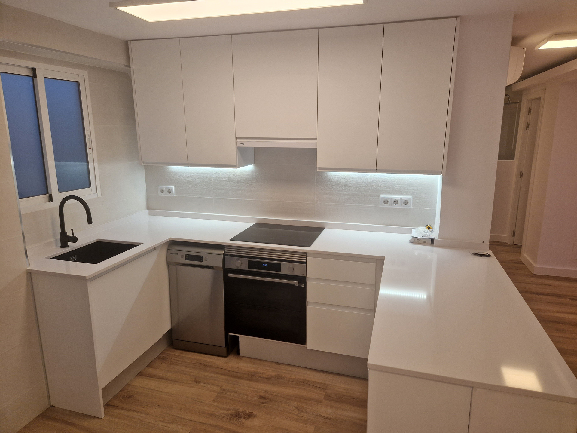 White kitchen with full appliances