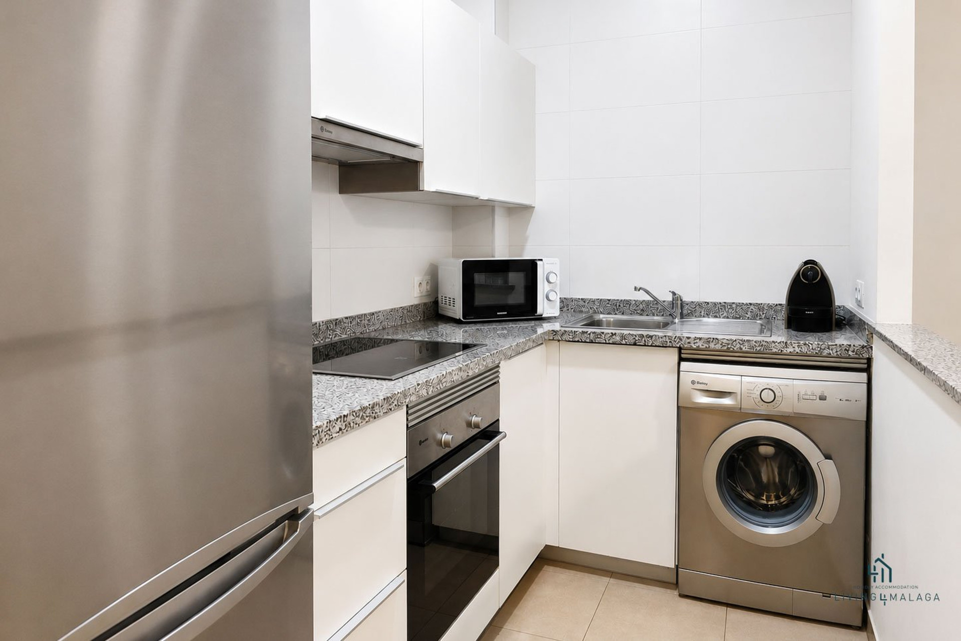 Kitchen with washer and oven